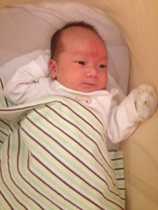 Caught a rare smile (more like a relief expression at this stage in development)