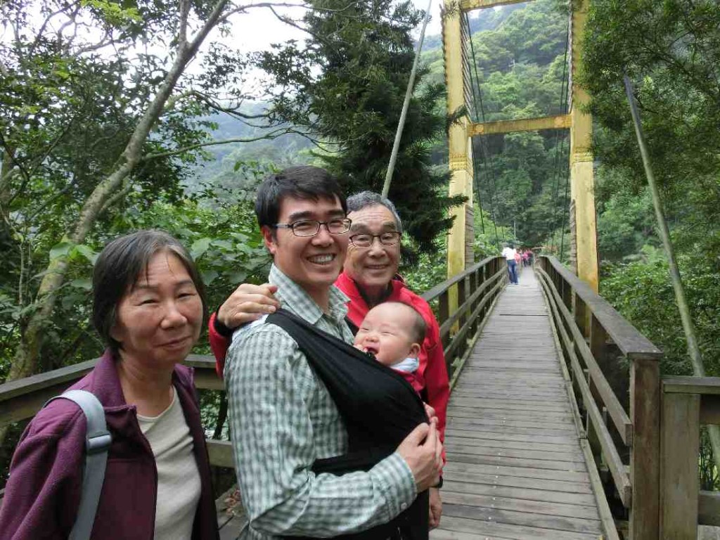 At the bridge connecting to a small island in the lake