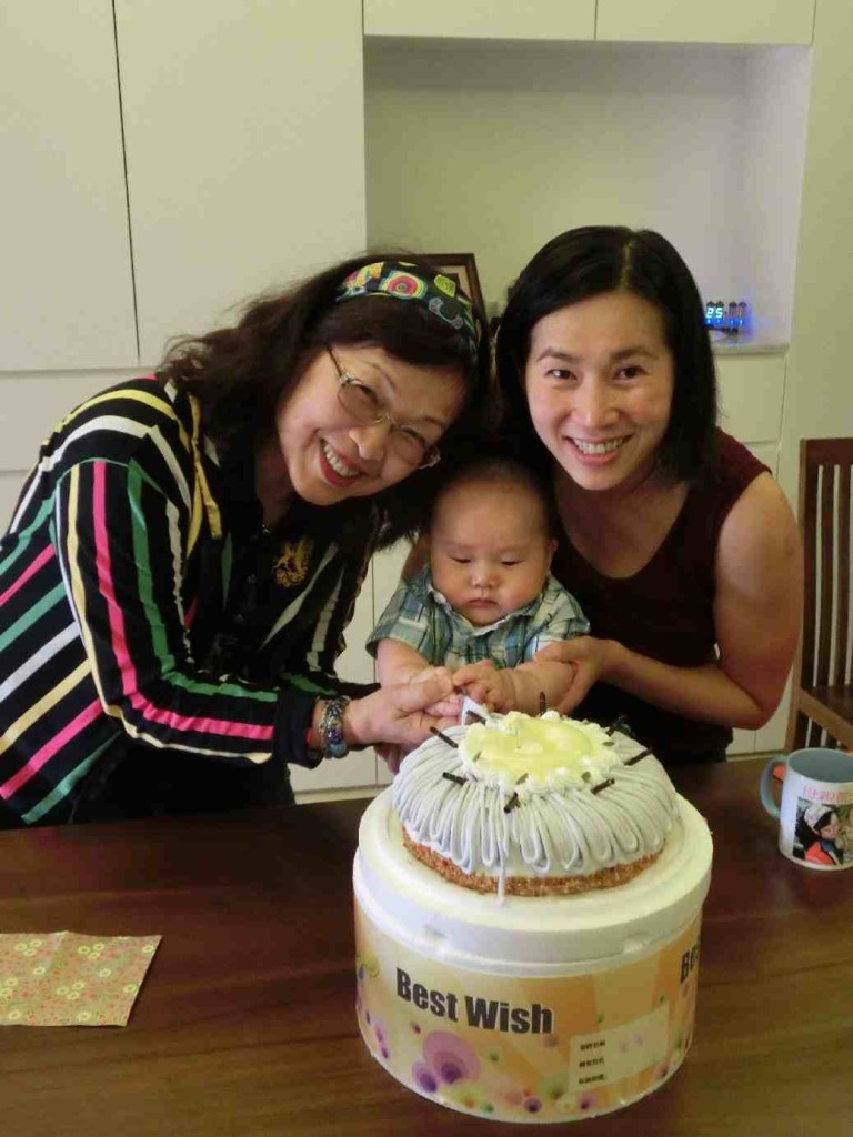 Ethan is concentrating in cutting the cake